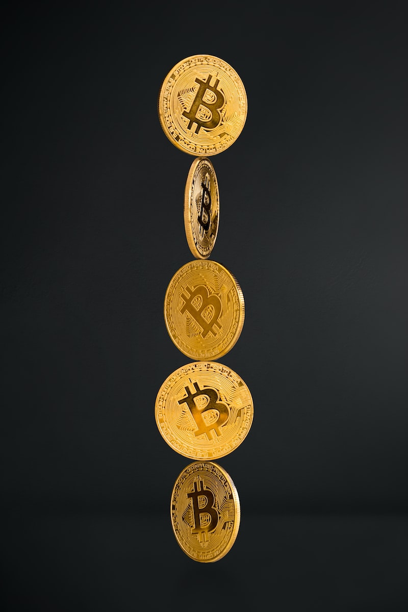 gold round coins on black background